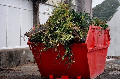 Gardener using tools for efficient garden clearance